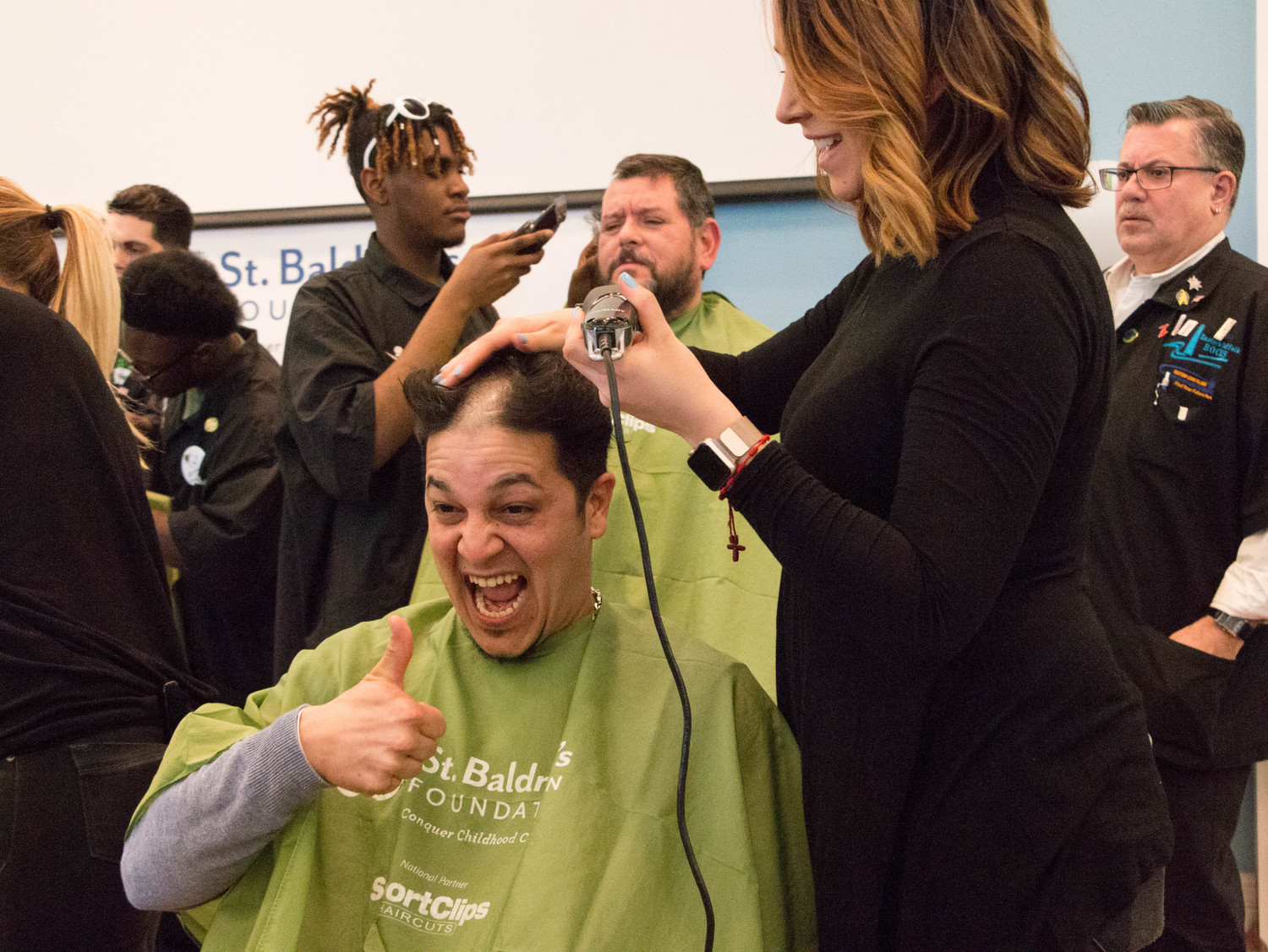 Juan C. Bosques got his head shaved at the St. Baldrick’s fundraiser in Rockville Centre last year, which was attended by more than 200 shavees and ponytail donators and helped raise about $450,000.
